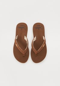 Brown flip-flops with a textured footbed and a tan thong strap. The inner lining features a subtle patterned detail.