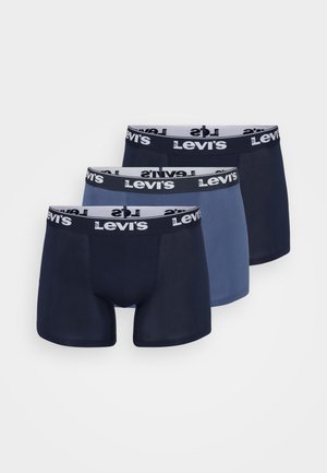 Tre paia di boxer briefs Levi's; colori: blu scuro, blu chiaro e blu. Presentano una vita nera con logo del marchio bianco. Tessuto morbido.