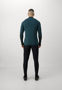 Under Armour CHALLENGER PRO - Donji dijelovi trenirke - black/ high-visibility yellow
