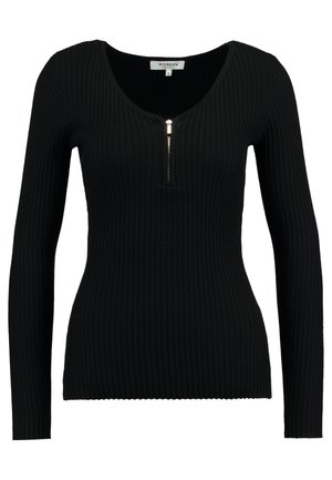 Svart ribbestrikket langermet topp med dyp utringning og glidelåsdetalj foran. Stoffet er teksturert og tettsittende.