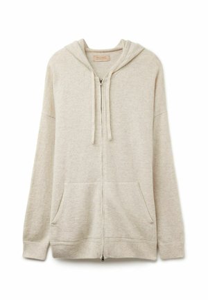 Felpa con zip beige realizzata in tessuto morbido e testurizzato. Presenta un cappuccio con stringa, due tasche frontali e polsini e orlo a costine.