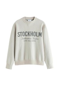 Cremefarvet sweatshirt med "STOCKHOLM" og "Sydøstlige Sverige" trykt i mørkegrå. Ribbede manchetter og kant, design med rund hals.