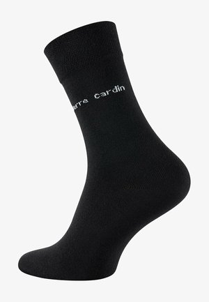 Schwarze Baumwollsocke mit festem Bündchen, glatter Textur und weißem Logo-Text "Pierre Cardin", der an der Seite angezeigt wird.