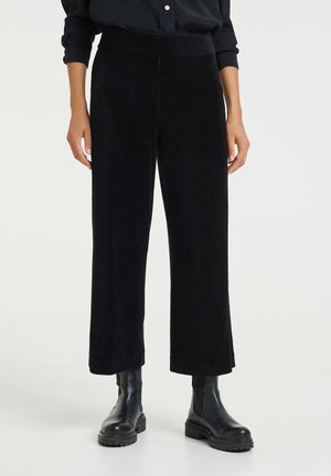 MISHA - Trousers - black