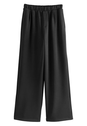 Čierne nohavice s širokými nohavicami, elastickým pásom a hladkou tkaninou, voľný strih, bez viditeľných vreciek alebo ozdôb.