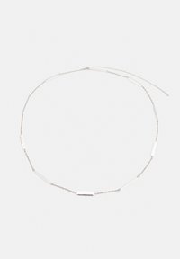 Silver chain necklace with elongated and rectangular links, interspersed with smaller links, creating a delicate and modern design.