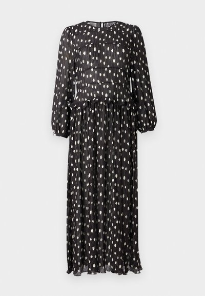 Mustmustritsiga must kleit pikkade varrukatega, millel on valged täpid ja volangiga ääreosa talje juures. Seljal lukuga kinnitamine.