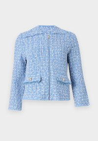 Blå tweedjakke med en teksturert overflate, har en frontglidelås, to lommer med dekorative knapper og kragefri design.