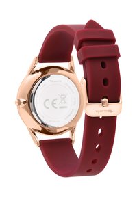 Roségoldener Edelstahlarmbanduhr mit rundem Gehäuse, rotem Silikonarmband und glatter Oberfläche. Wasserfest bis 3 ATM.