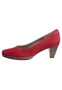 Decolleté in pelle rossa con punta arrotondata, tacco medio impilato e texture liscia. Una sottile cucitura tono su tono accentua il design.