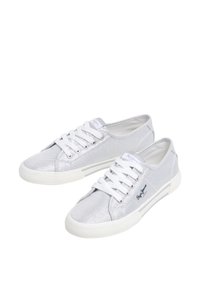 Silver canvas sneakers with white laces, textured fabric, rubber sole, and logo detail on the side. Classic low-top design.