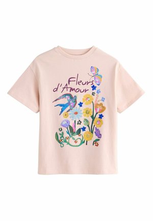 Light pink t-shirt with colorful floral design, a blue bird, a butterfly, and the text "Fleurs d’Amour" in purple cursive.