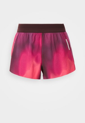 Roosa ja lilla gradienti spordilühikesed püksid elastse vöökoha ja sileda tekstuuriga, küljes silt. Pükstel on mugav lõige.