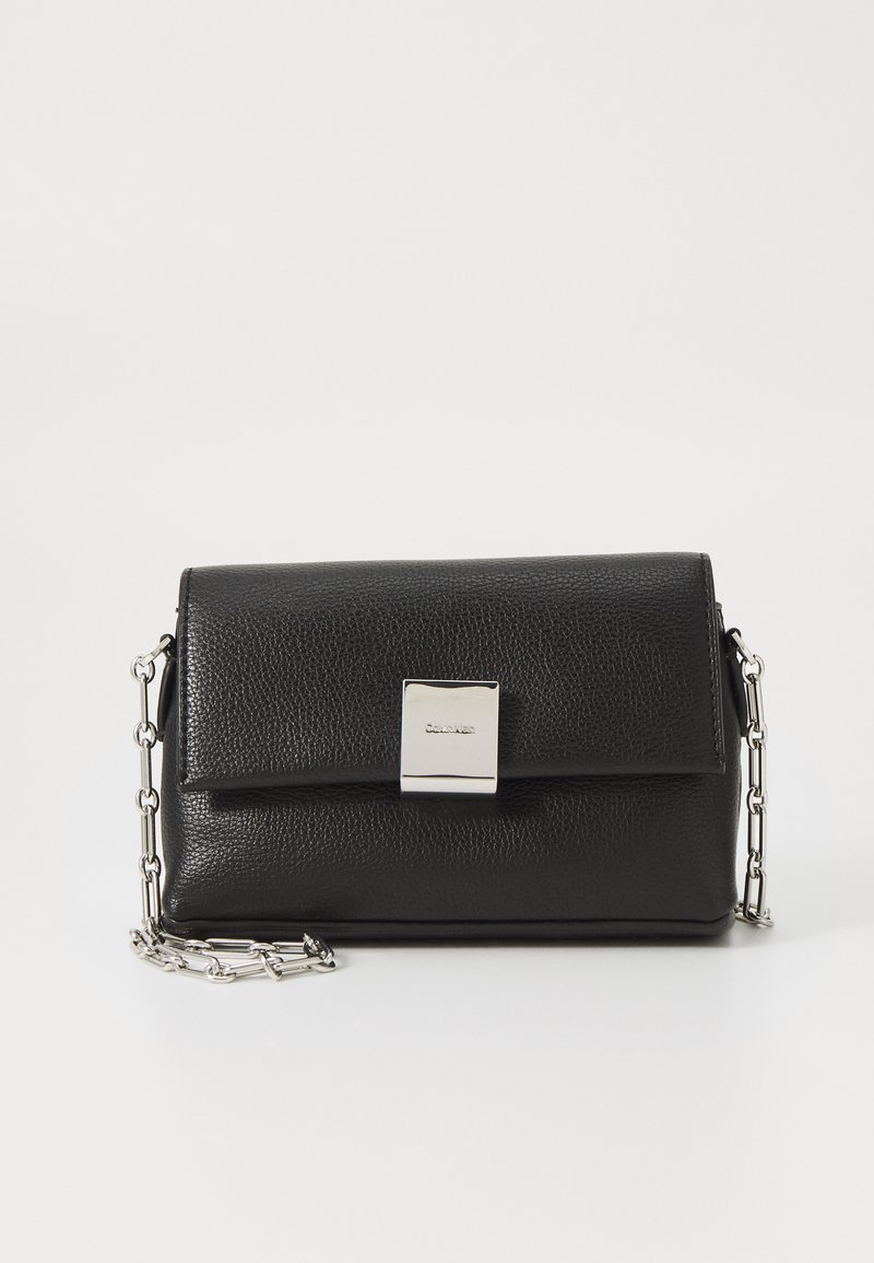 Black leather crossbody bag with a textured finish, rectangular shape, silver hardware clasp, and a short chain strap.