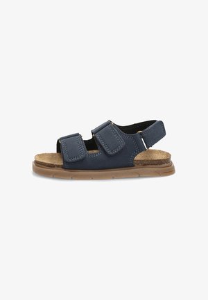 Sandalia azul marino con punta abierta, doble tiras ajustables y una suela acolchada color marrón claro, diseñada para la comodidad y el uso casual.