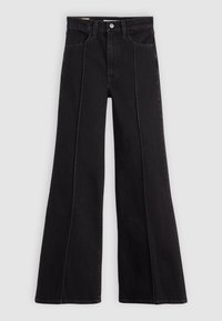 Jeans en denim noir taille haute avec jambes larges, fermeture frontale boutonnée et à zip, poches avant, et détails de coutures visibles le long des jambes.