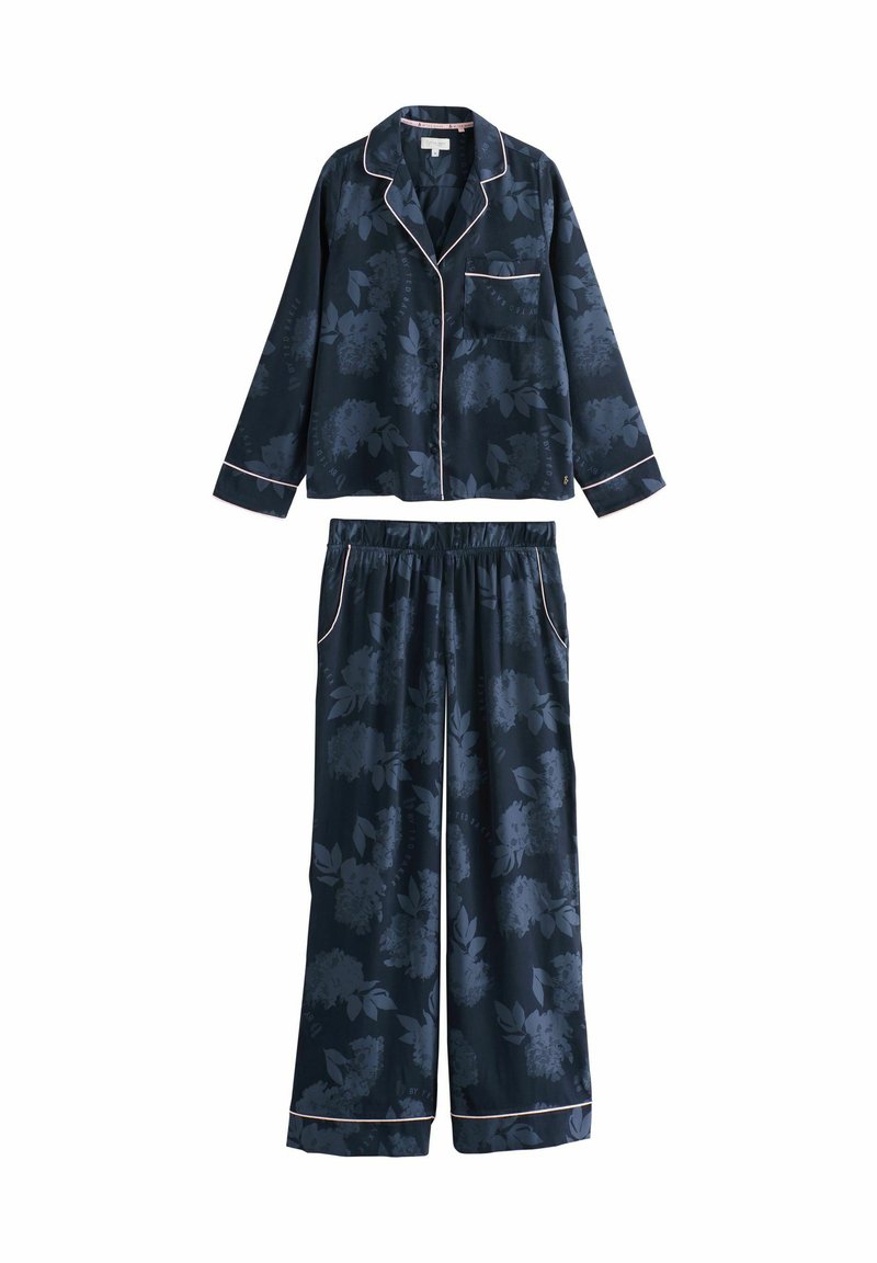 Navy floral pajama set in soft fabric, featuring long sleeves, a button-up shirt with a pocket, and elastic waist pants with contrasting piping.