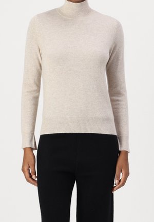 Stickad tröja - beige