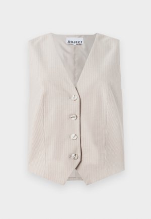 Beige ermeløs vest med vertikale striper, v-hals, fem knapper foran og sidelommer. Laget av teksturert stoff.