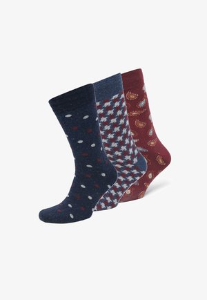 Drei Paar Socken: dunkelblau mit weißen und roten Punkten, gemustert in Grau und Hellblau, sowie bordeauxrot mit Paisleymuster. Baumwollmischung.