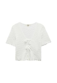 Vit kortärmad texturerad crop top med V-ringning och två främre knytningar med små pärldetaljer.