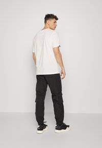 ELHO LIMONE 89 - Pantalon classique - black