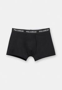 Crna pamučna bokserica s uskim krojem, koja ima pojas s natpisom "PULL&BEAR" u bijelom, glatke teksture i bez uzoraka.