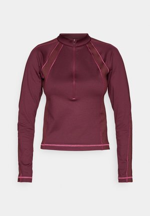 Bordo garais piedurkņu tops ar puspogājamu apkakli, ar kontrastējošām rozā šuvēm un sietveida paneļiem malās. Gluda tekstūra.