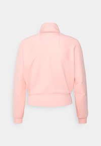 Nike Performance HERITAGE JACKET - Casaco de treino - bleached coral