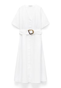White midi dress with short sleeves, button-down front, and wide belt featuring a tortoiseshell buckle.