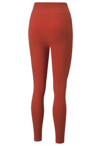Rode geribbelde leggings met een hoge taille, voorzien van een subtiele textuur en een logo-detail op de achterkant van de tailleband. Glad, rekbaar materiaal.