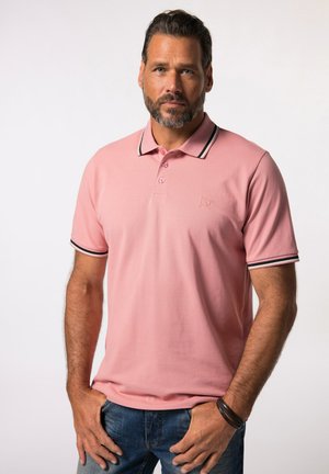 Lyserød polo skjorte med krave, prydet med sort og hvid stribede detaljer på ærmerne. Fremstillet af et glat, åndbart stof.