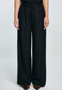 EMISI - Trousers - schwarz