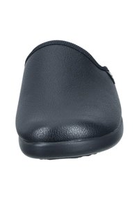 Sort lædersko uden snørebånd med en glat overflade, rund tå og en lav hæl. Har en syet kant og et diskret brandlogo på siden.
