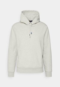 Jasnoszara bluza z kapturem z przednią kieszenią, sznurkami i małym niebieskim logo. Miękki materiał, luźny krój oraz ściągacze na mankietach dla wygody.