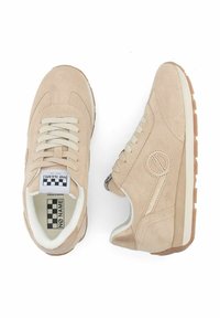 Beige suede sneakers with textured surface, round toe, white midsole, lace-up design, and black and white checkered label inside.