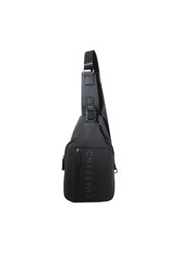 Borsa a tracolla nera realizzata in materiale resistente, con una superficie liscia, cinturino regolabile e un compartimento con zip arricchito da un dettaglio del logo.