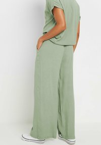 M&Co WIDE - Pantalones - light green