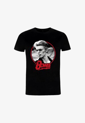 Czarna bawełniana koszulka z okrągłym wzorem przedstawiającym mężczyznę w okularach przeciwsłonecznych i z papierosem, z towarzyszącym napisem "BOWIE" w kolorze czerwonym.