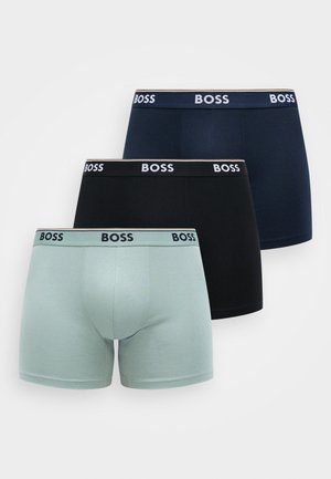 Three pairs of boxer briefs in mint green, navy, and black, featuring a waistband with the brand name "BOSS" in white lettering.