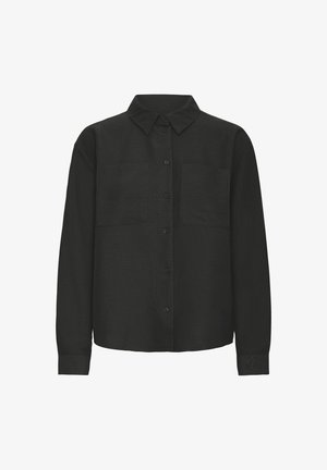 Juodas mygtukų užsegamas marškinys, pagamintas iš tekstūruotos medžiagos, su apykakle, ilgomis rankovėmis ir dviem krūtinės kišenėmis. Paprastas ir tiesus kirpimas.