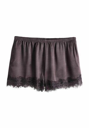 Sötétszürke szatén rövidnadrág elasztikus derékpánttal és fekete csipke díszítéssel az alsó szegély mentén, fehér háttéren elrendezve.