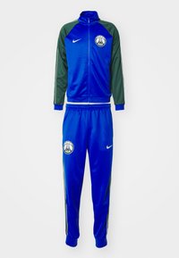 Blue and green Nike tracksuit featuring a zip-up jacket with logo and pants with an elastic waistband, made of smooth, lightweight material.