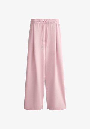 Pantalon large rose pâle avec taille élastique et cordon, fabriqué en tissu lisse, présenté sur fond blanc.