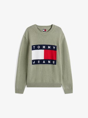 Zöld kötött pulóver, amely nagy blokk mintával rendelkezik, rajta "TOMMY" és "JEANS" felirat fehér, piros és térkék színekben. Bordás nyak és mandzsetta.