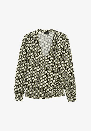 Haut croisé à manches longues de couleur vert olive, présentant un motif géométrique de cercles et d'ovales en noir et blanc. Tissu doux avec un design drapé.