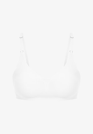 Soutien-gorge sans fil blanc avec un tissu lisse, des coutures minimales, un design en V, des bretelles fines et réglables, et un matériel en métal pour l'ajustement.