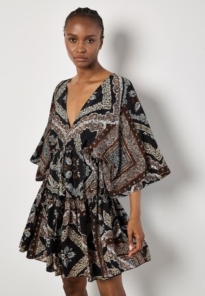 Black knee-length dress with a deep V-neck, featuring a floral and paisley pattern in white and brown. Short, wide sleeves and a gathered waist.