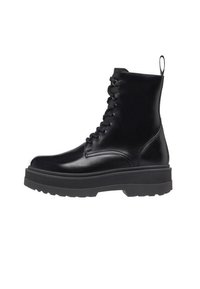 Schwarze Lederkampfstiefel mit runder Zehenpartie, dickem Gummisohle und Schnürung vorne. Mit einem Ziehschlaufen an der Rückseite für einfaches Anziehen.