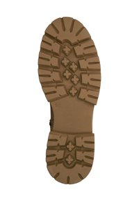 Suela de bota de goma en color marrón, con profundos relieves y detalles en patrón cruzado para un mejor agarre. Superficie lisa con un diseño moldeado para una mayor durabilidad.